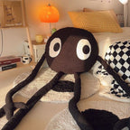 Peluche Blob Noir aux Grands Yeux et Longs Membres