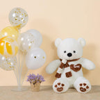 Ours en Peluche Beige à Écharpe Rayée et Pattes Cœurs