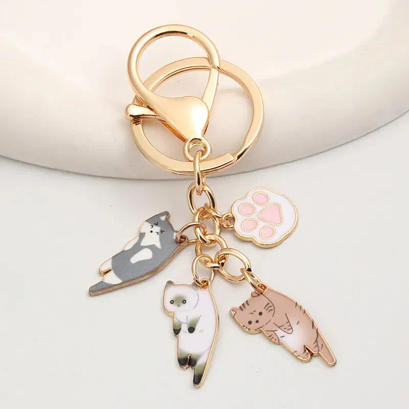 Porte-clés en Métal Doré Multi-Chats et Patte Rose