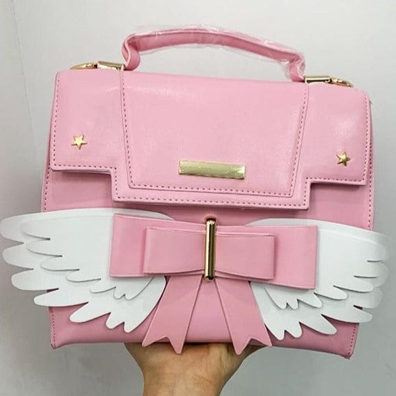 Sac à Main Rose Pâle à Ailes Blanches et Nœud Doré