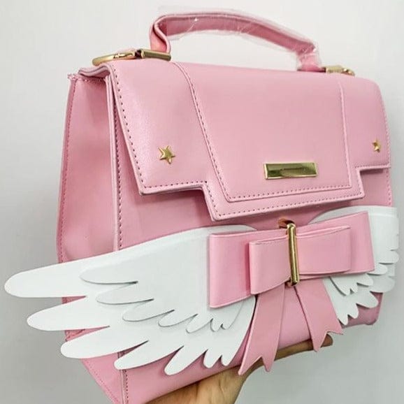 Sac à Main Rose Pâle à Ailes Blanches et Nœud Doré