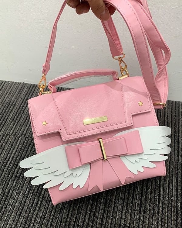 Sac à Main Rose Pâle à Ailes Blanches et Nœud Doré