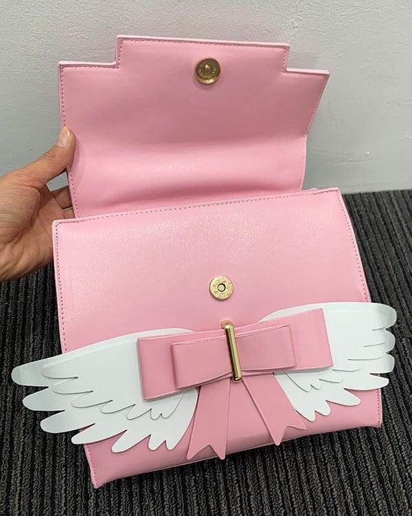 Sac à Main Rose Pâle à Ailes Blanches et Nœud Doré