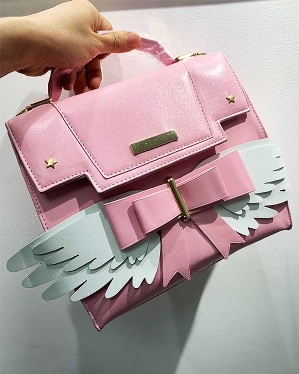 Sac à Main Rose Pâle à Ailes Blanches et Nœud Doré