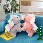 Peluche Éléphant Rose ou Grise à Ailes et Défenses