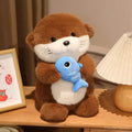Peluche Loutre Marron avec Poisson Bleu